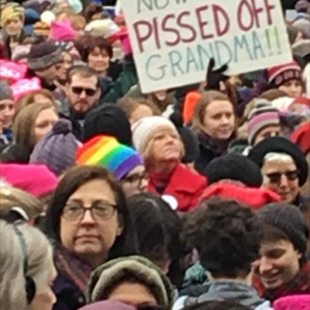 A crowd of mostly women and a sign reading Pissed Off Grandma!