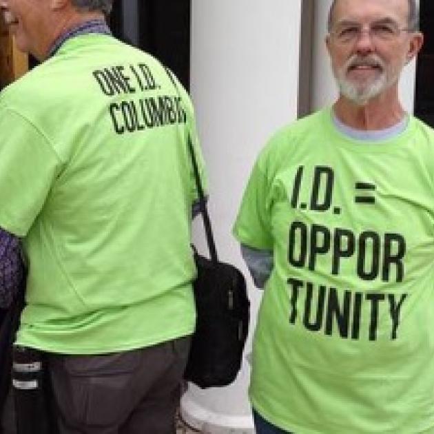 Two men wearing OneID T-shirts