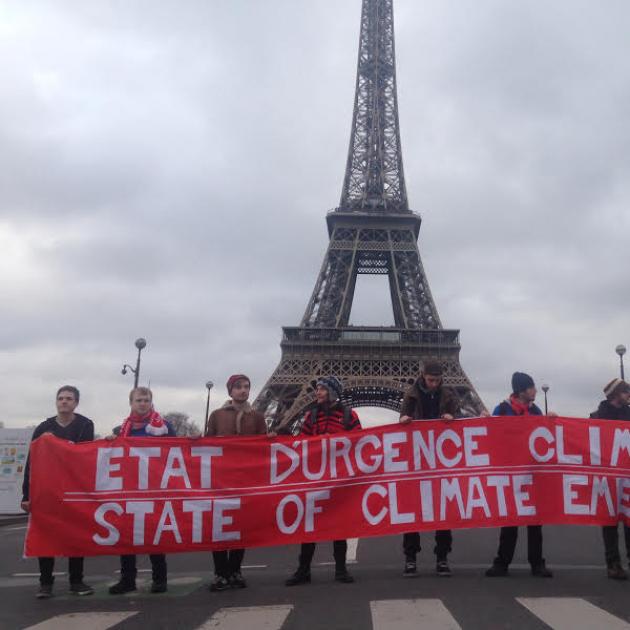 Eiffel Tower with big climate justice sign in front