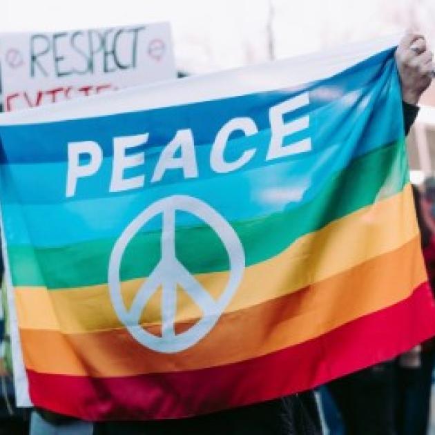 Peace sign on rainbow flag