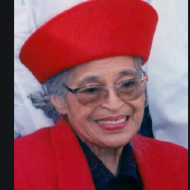 Older woman in red hat