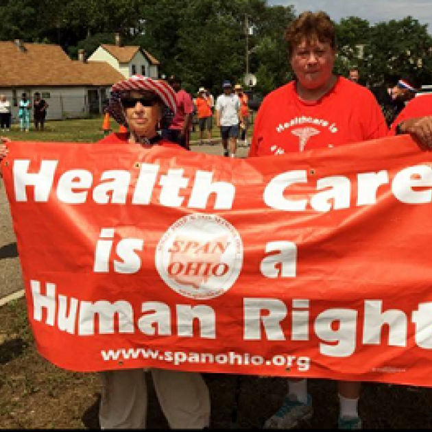 People with sign Health Care is a Human Right