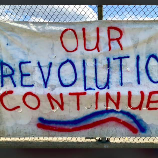 Sign saying Our Revolution Continues