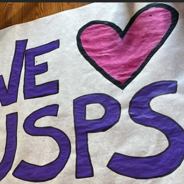 Sign saying We Love USPS