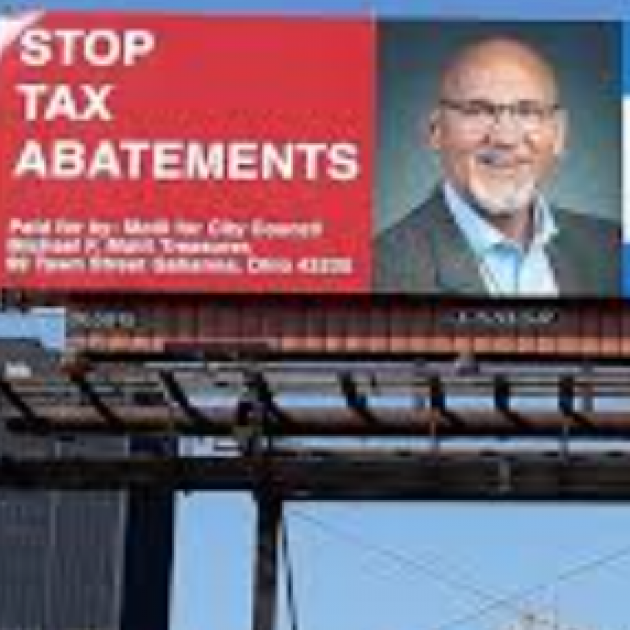 Billboard that says Stop Tax Abatements with Joe Motil's face