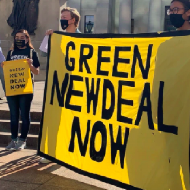 Sign saying Green New Deal Now