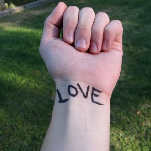 Love tattooed on a wrist