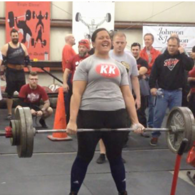 Young woman lifting barbells