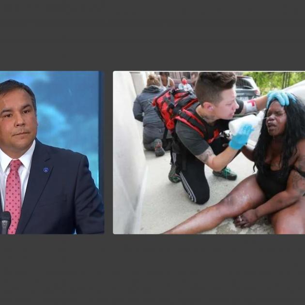 Mayor Ginther and photo of protester