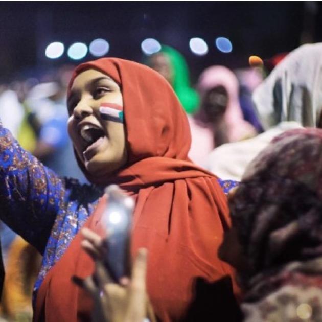 Woman shouting in a crowd