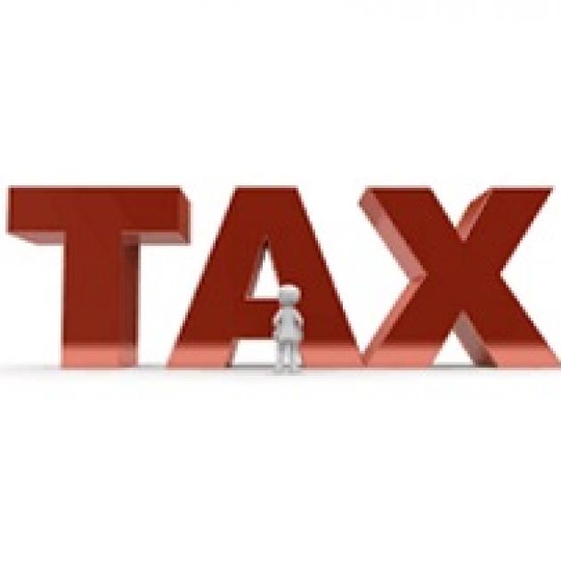 The word TAX in big red letters with a little man standing in front