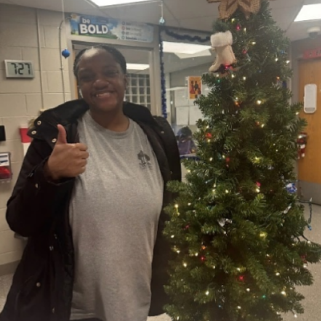 Woman by a Xmas tree