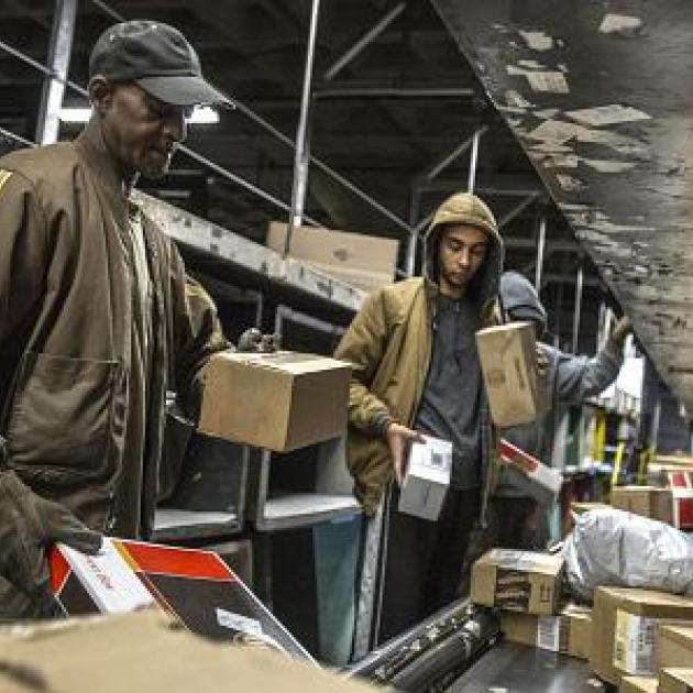 People working with boxes at UPS