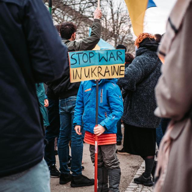 Child with sign Stop War in Ukraine