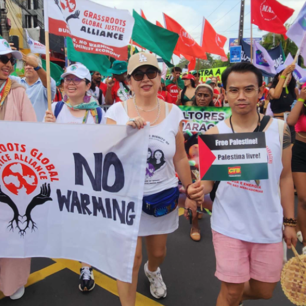 People marching and holding a banner