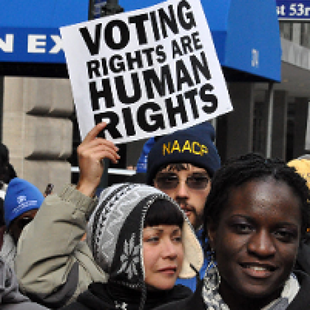 People and sign held high saying Voting Rights are Human Rights