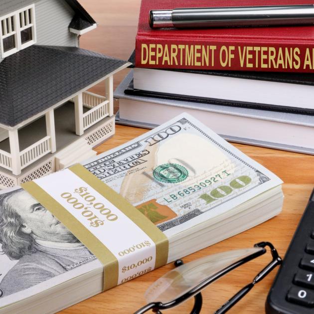 Money, house, book titled Dept of Veterans Affairs