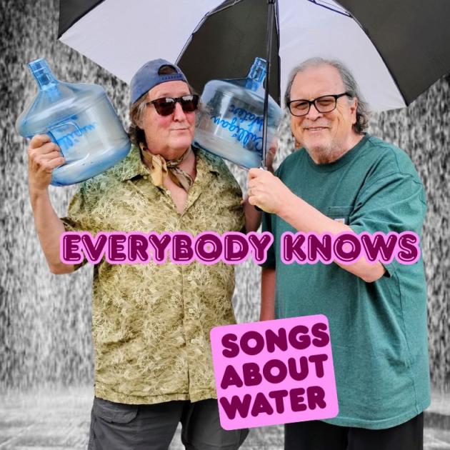 Bob and Dan with an umbrella and water bottles