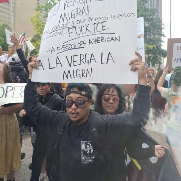 Man holding protest sign