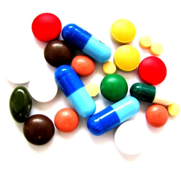A pile of colorful and different sized pills