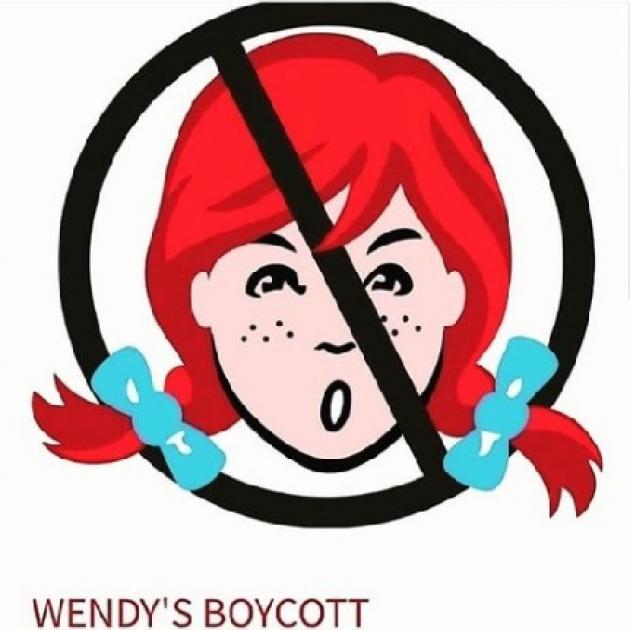 Drawing of girl's head with red pigtails with blue bows and freckles with a circle and line through it in black on top of her indicating No, and the words Wendy's Boycott