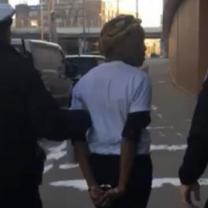 Black woman being arrested