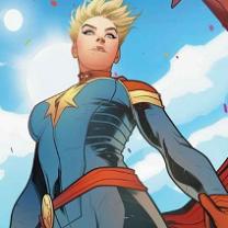 Female superhero comicbook character wearing a tight blue onesie, a red belt, gold epaulets on the shoulders. short blonde hair very spiky against a blue sky with clouds