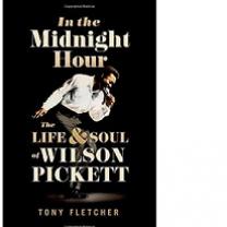 Book cover, black bakground, photo of black man bending over with a mic to his mouth singing and arm swinging backwards and the words In the Midnight Hour the life & soul of Wilson Pickett by Tony Fletcher 