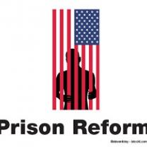 A flag hanging sideways and a silhouette of a man behind the red stripes as if they are bars and the words Prison Reform at the bottom