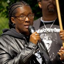 Black woman talking into a mic