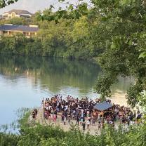 People gathered by a quarry