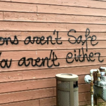 Spray painting on wall saying If abortions aren't safe you aren't either