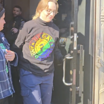 Young woman being arrested