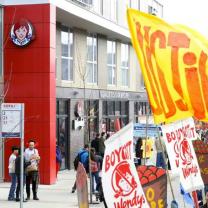 People protesting outside Wendy's building