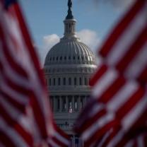 Capitol bldg between two flags