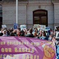 Protest with sign Fund Childcare Now