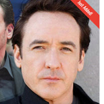 White man's face looking squinty eyed toward the camera without a smile 