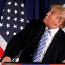 Donald Trump at podium looking sideways and stupid
