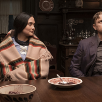 Native woman and white man at a dinner table