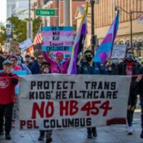People holding sign and marching