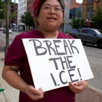 Woman with sign saying Break the ICE