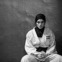 Person sitting in judo outfit