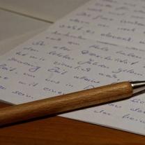 Written letter and a pen