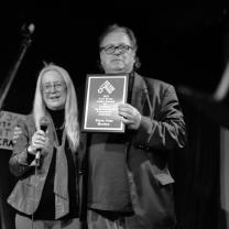 Bob and Mary Jane posing with plaque