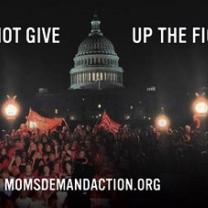 Big government building rotunda in the dark and people rallying in front