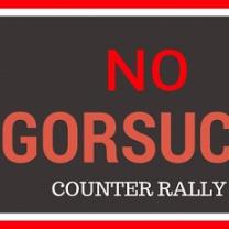 Red words on black saying No Gorsuch counter rally