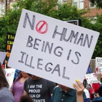 No Human Being is Illegal sign