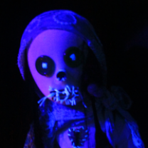 Creepy doll head in blue light