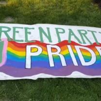 Banner in rainbow colors saying Green Party Pride