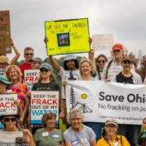 Outdoor protest with signs about Save Ohio Parks